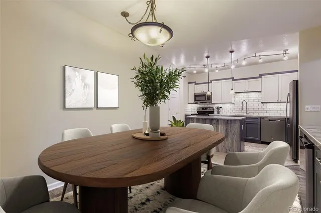 a dining room with furniture and window