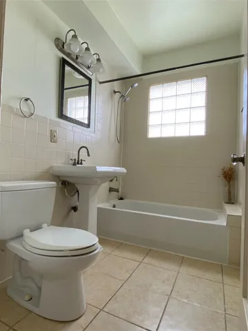 a bathroom with a toilet sink and bathtub