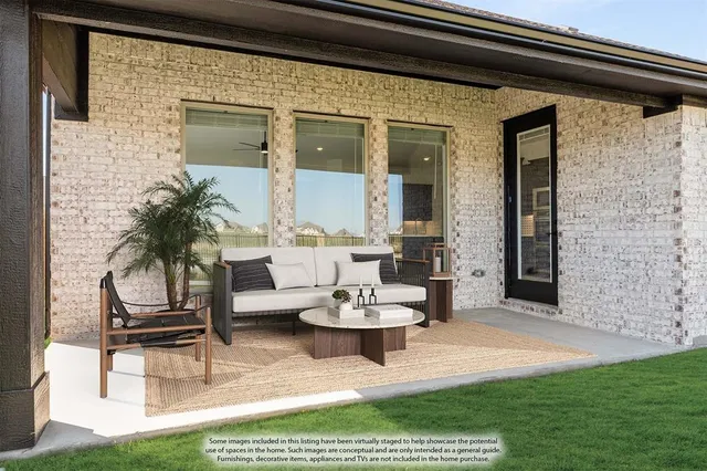 a view of a house with backyard and porch