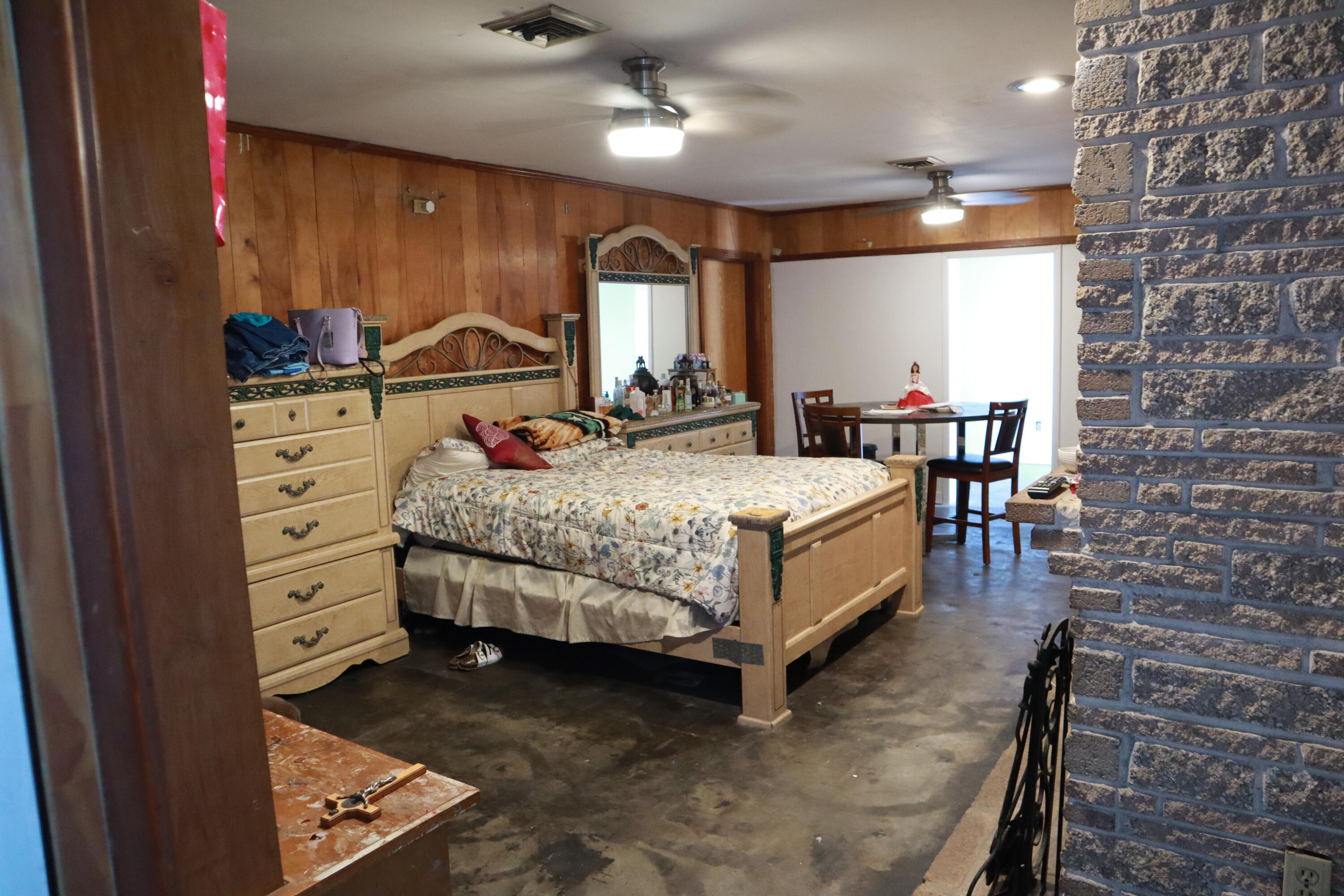 360 Kismet Avenue Pahokee, FL 33476 - Photo 13 of 100 a bedroom with a bed next to a window with the kitchen view