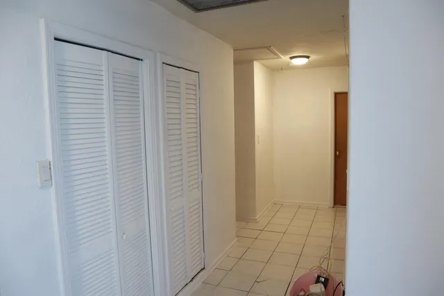 a bathroom with a double vanity sink and mirror
