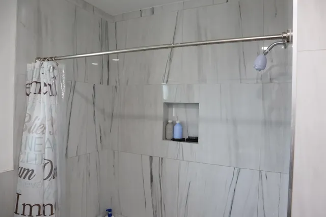 a bedroom with a bed and a closet