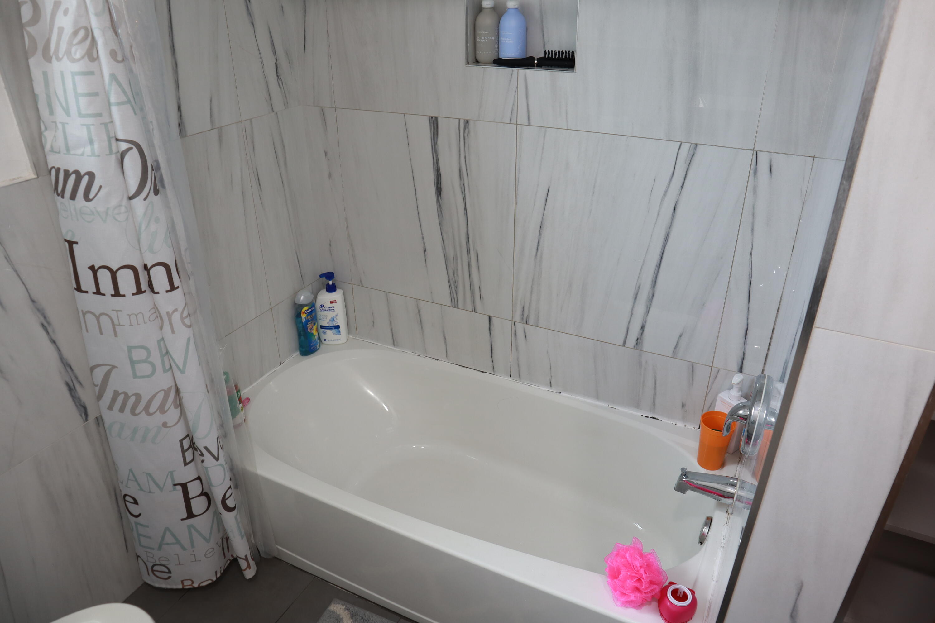 360 Kismet Avenue Pahokee, FL 33476 - Photo 28 of 100 a bathroom with a bathtub and shower