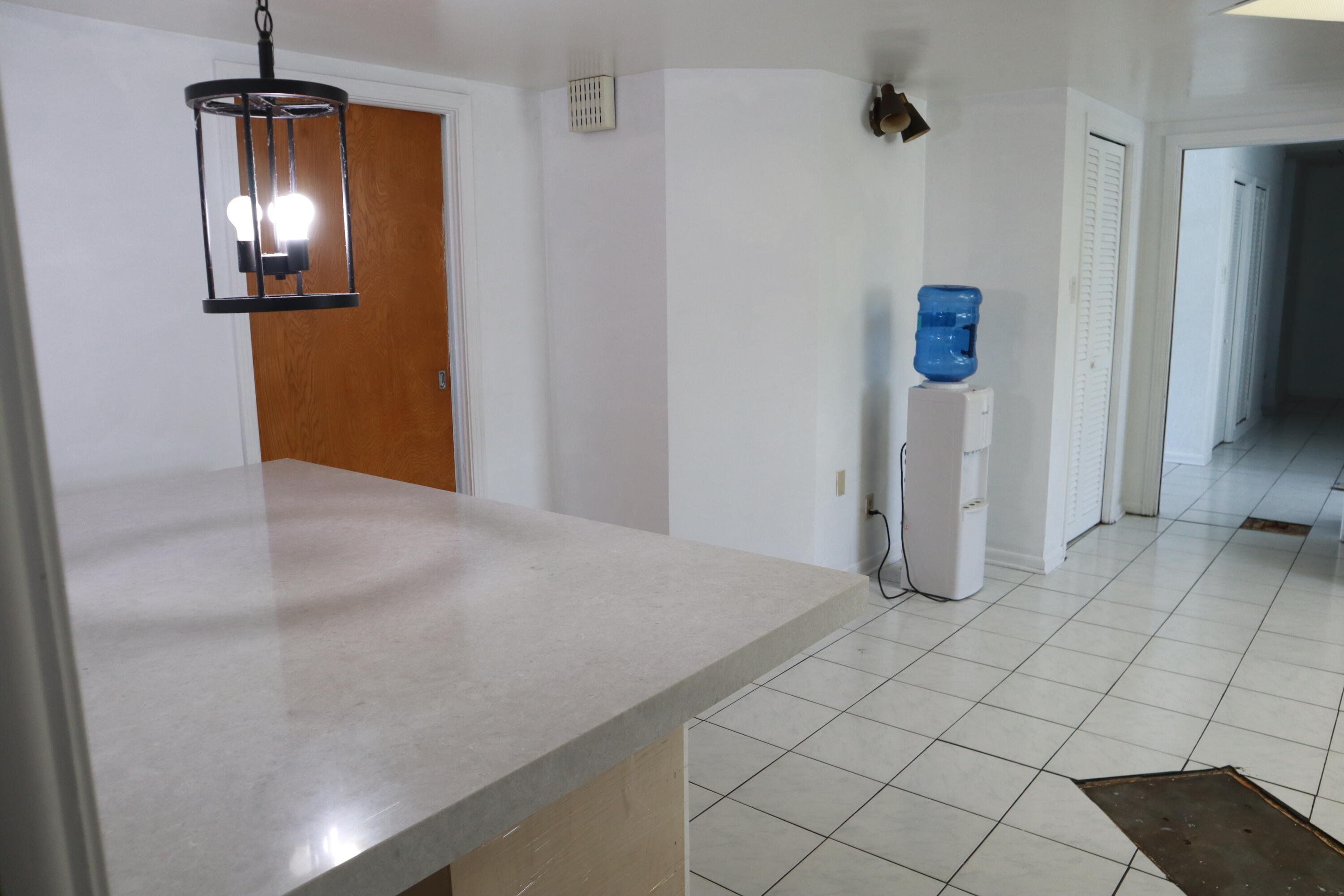 360 Kismet Avenue Pahokee, FL 33476 - Photo 36 of 100 a view of empty room with window and chandelier