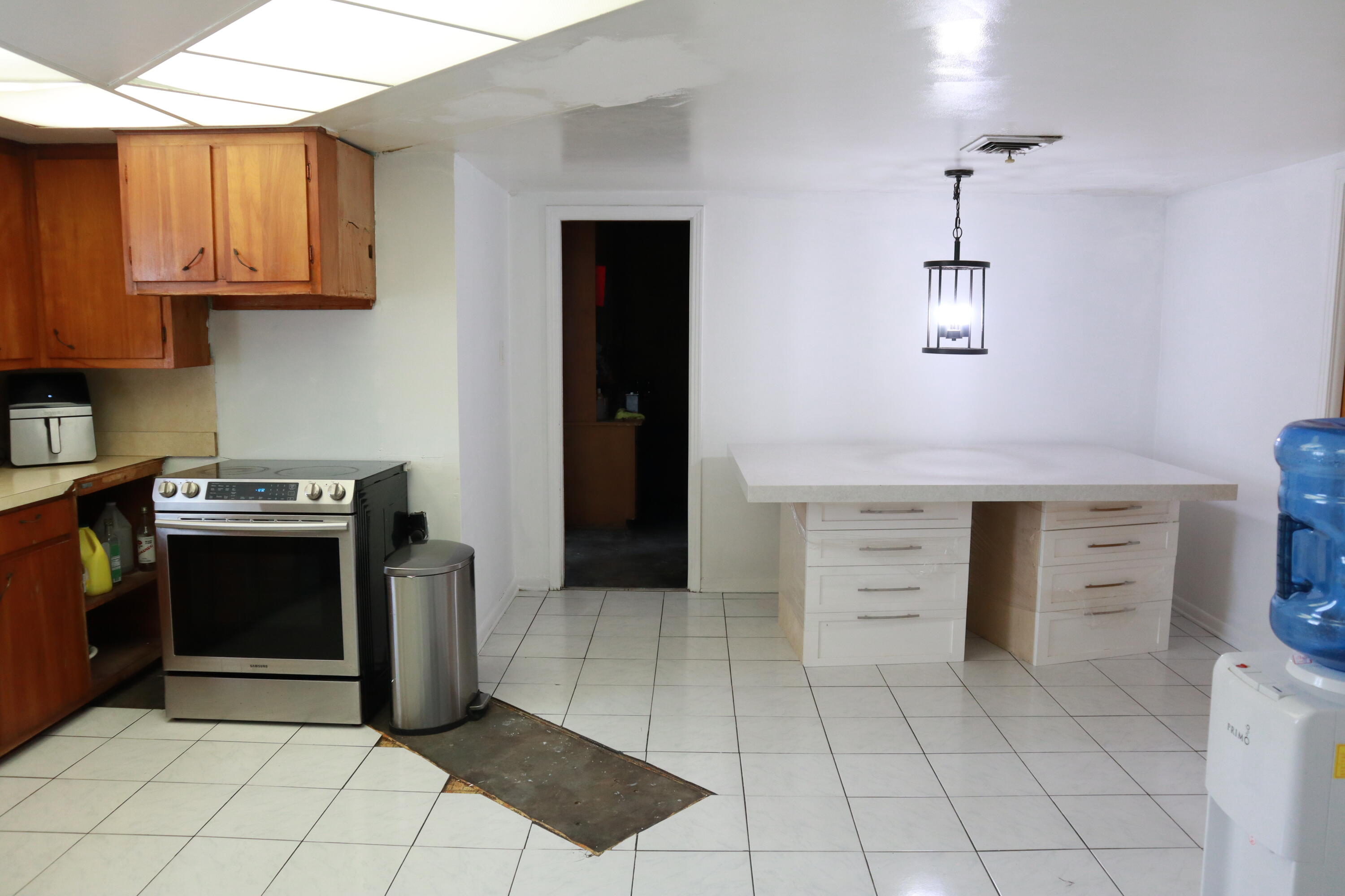 360 Kismet Avenue Pahokee, FL 33476 - Photo 38 of 100 a kitchen with stainless steel appliances granite countertop a stove and a refrigerator