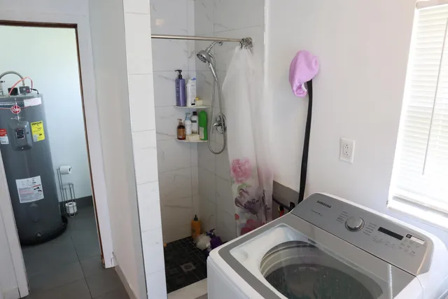 a white toilet sitting next to a sink