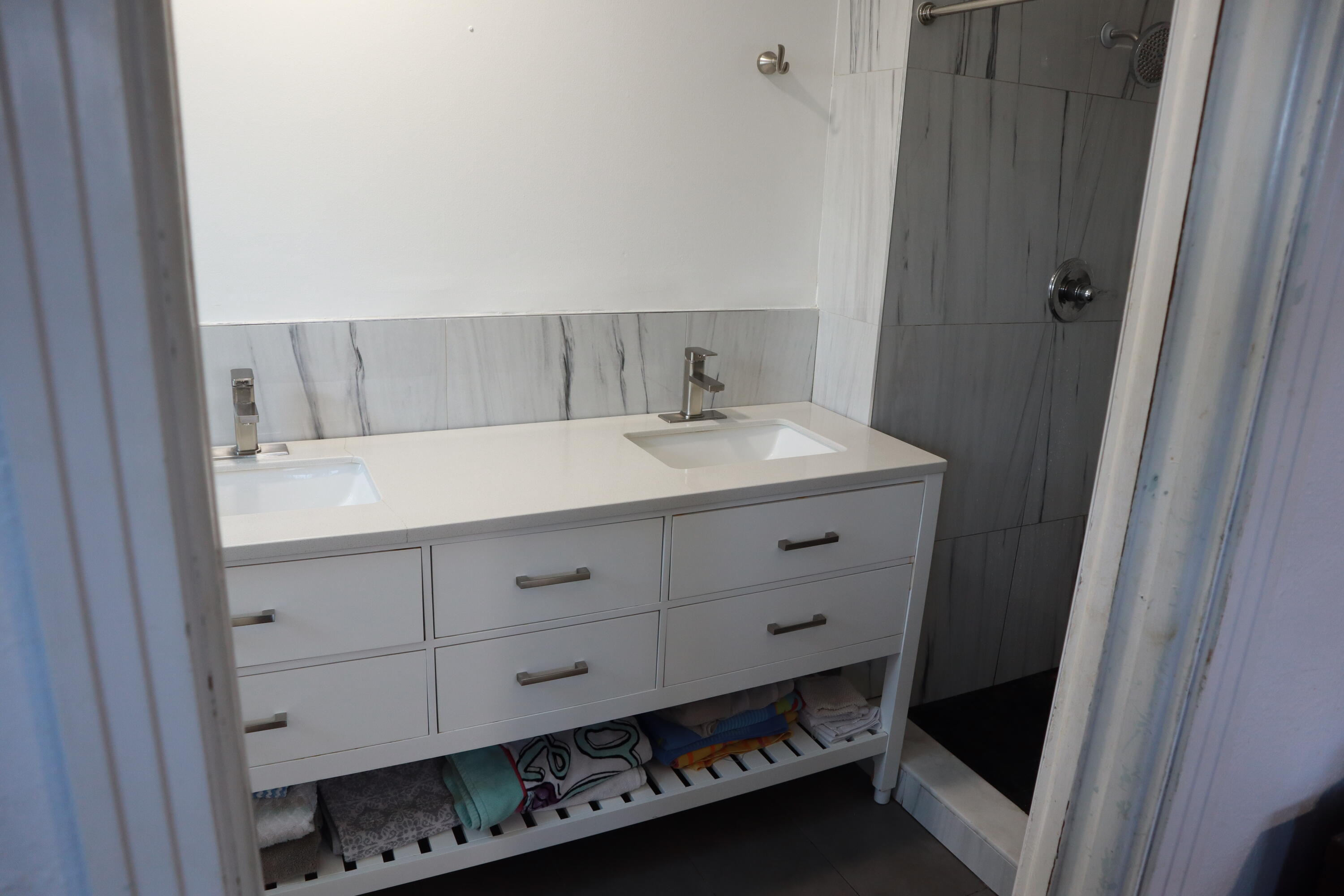 360 Kismet Avenue Pahokee, FL 33476 - Photo 44 of 100 a bathroom with a sink and a mirror