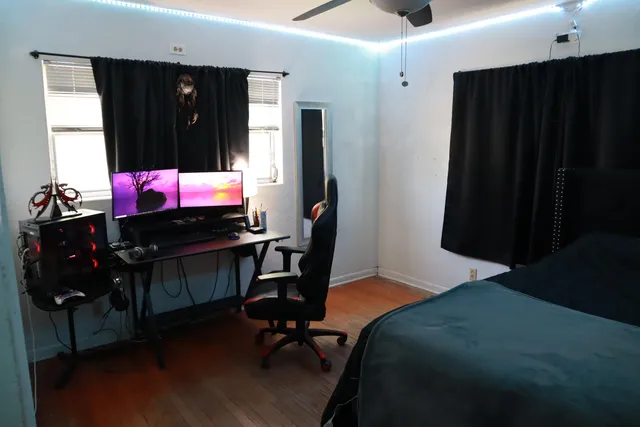 a view of a porch with chairs and backyard