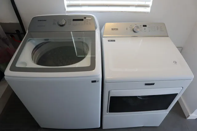 a view of an empty room and a window