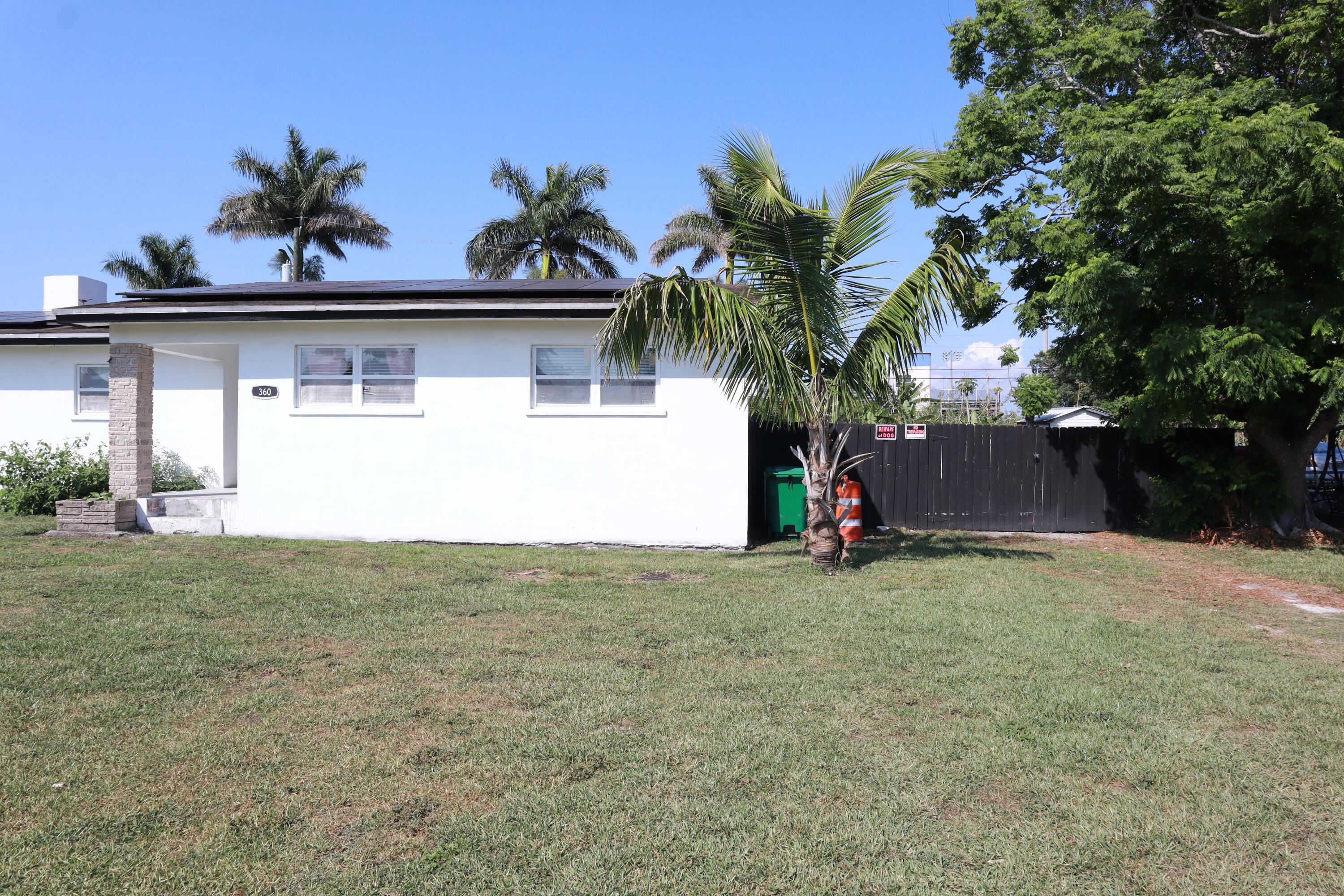360 Kismet Avenue Pahokee, FL 33476 - Photo 65 of 100 a view of a house with a yard and plant