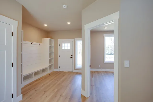 a view of entryway with wooden floor