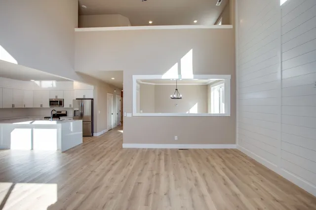 a view of a kitchen with a sink and a stove