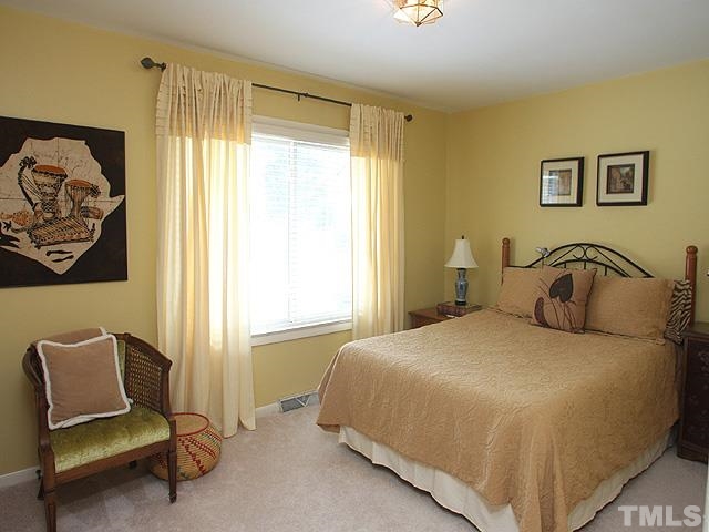 321 Trotters Ridge Drive Raleigh, NC 27614 - Photo 14 of 20 a bedroom with a bed and a chair
