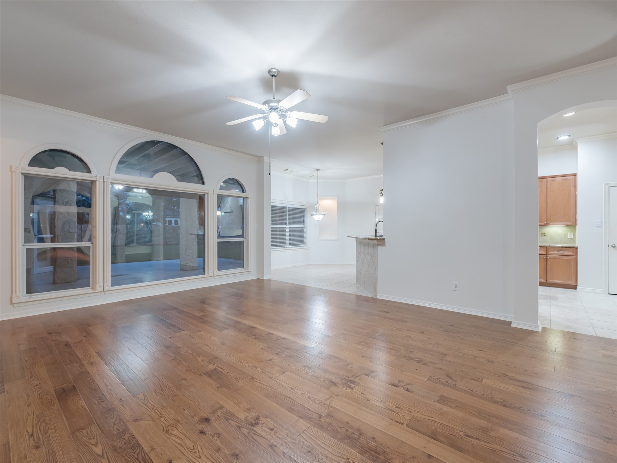 1511 Baldridge Lane Katy, TX 77494 - Photo 14 of 50 a view of an empty room with wooden floor and a window