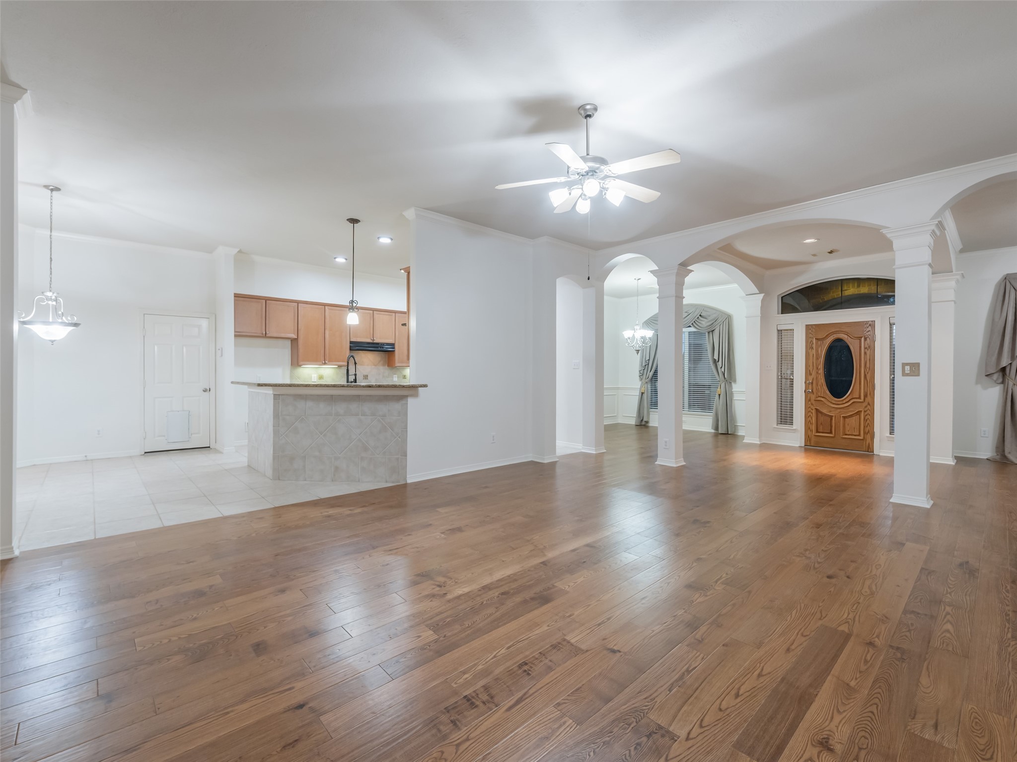1511 Baldridge Lane Katy, TX 77494 - Photo 15 of 50 a view of a kitchen with a sink a kitchen island stainless steel appliances refrigerator and cabinets
