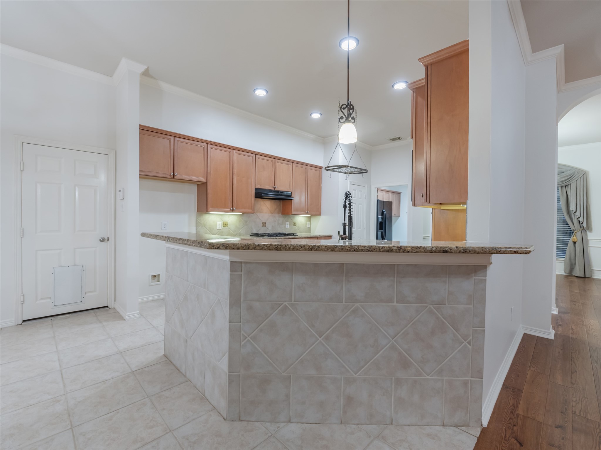 1511 Baldridge Lane Katy, TX 77494 - Photo 17 of 50 a kitchen with stainless steel appliances granite countertop a refrigerator and a sink