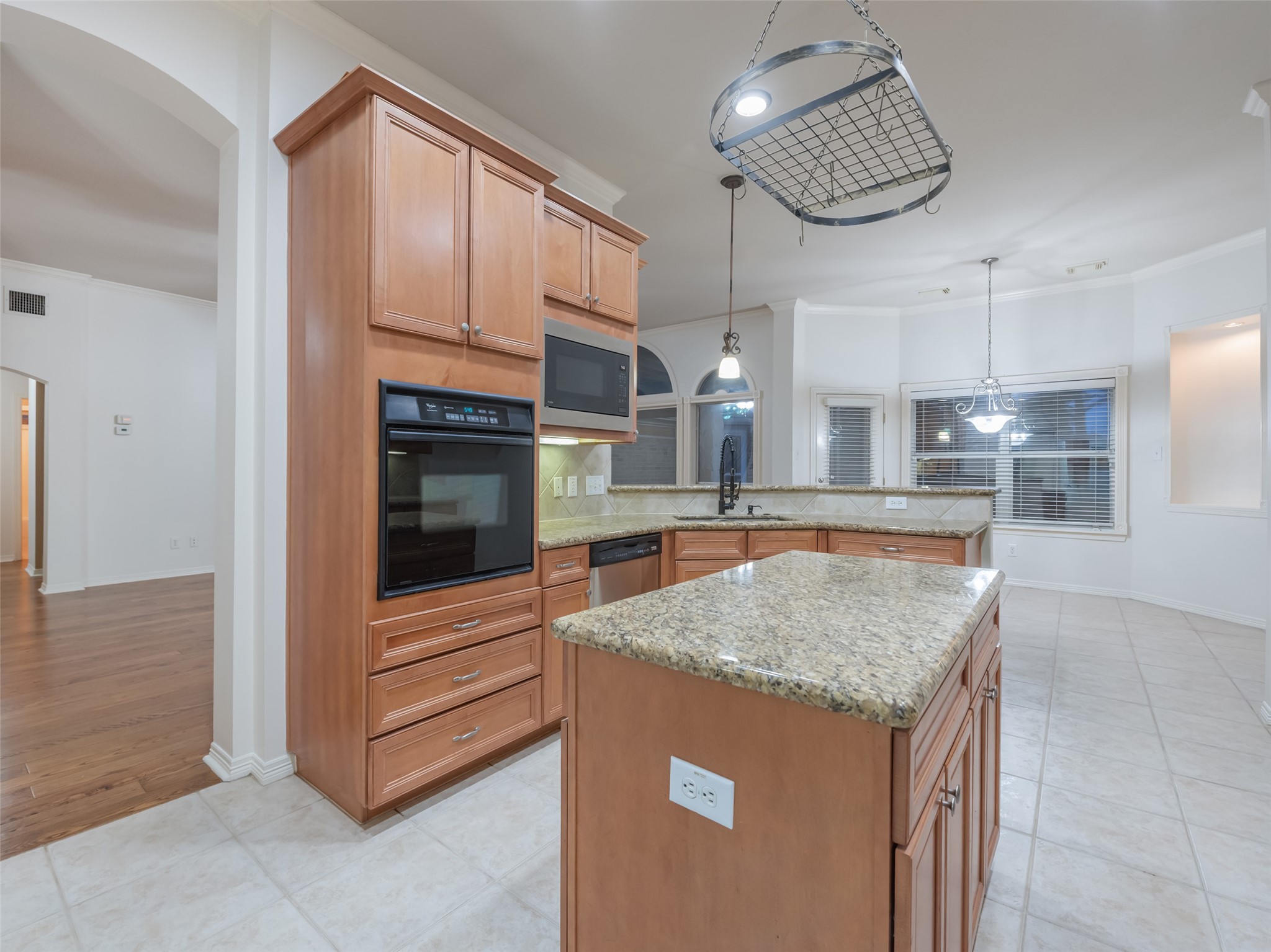 1511 Baldridge Lane Katy, TX 77494 - Photo 21 of 50 a kitchen with stainless steel appliances granite countertop a sink and a refrigerator