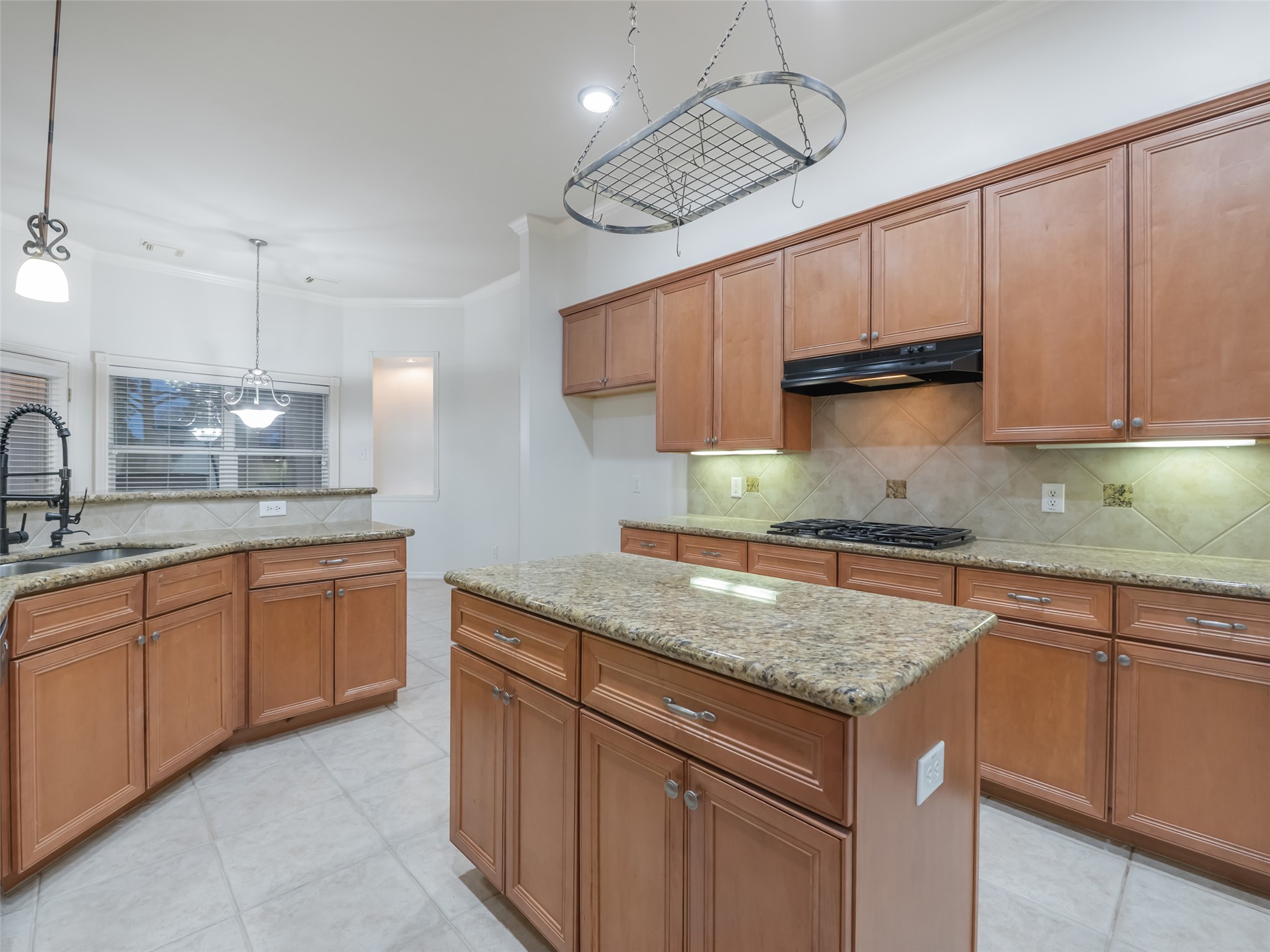 1511 Baldridge Lane Katy, TX 77494 - Photo 22 of 50 a kitchen with granite countertop a sink a counter space appliances and cabinets