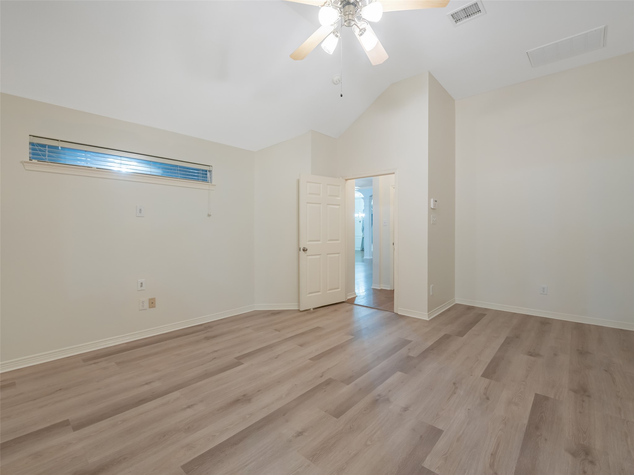 1511 Baldridge Lane Katy, TX 77494 - Photo 25 of 50 a view of an empty room with wooden floor