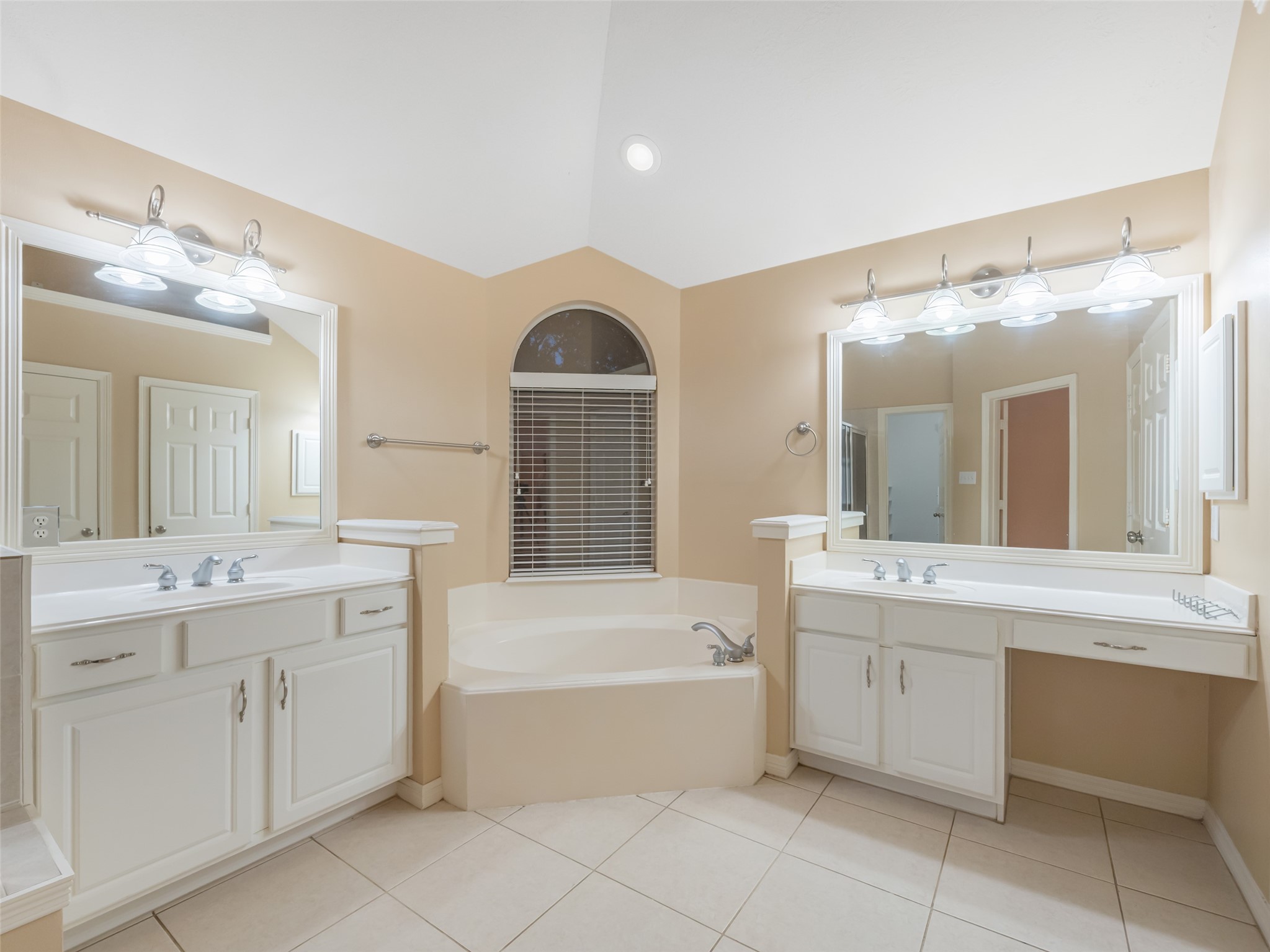 1511 Baldridge Lane Katy, TX 77494 - Photo 28 of 50 a bathroom with a sink a large mirror and a bathtub