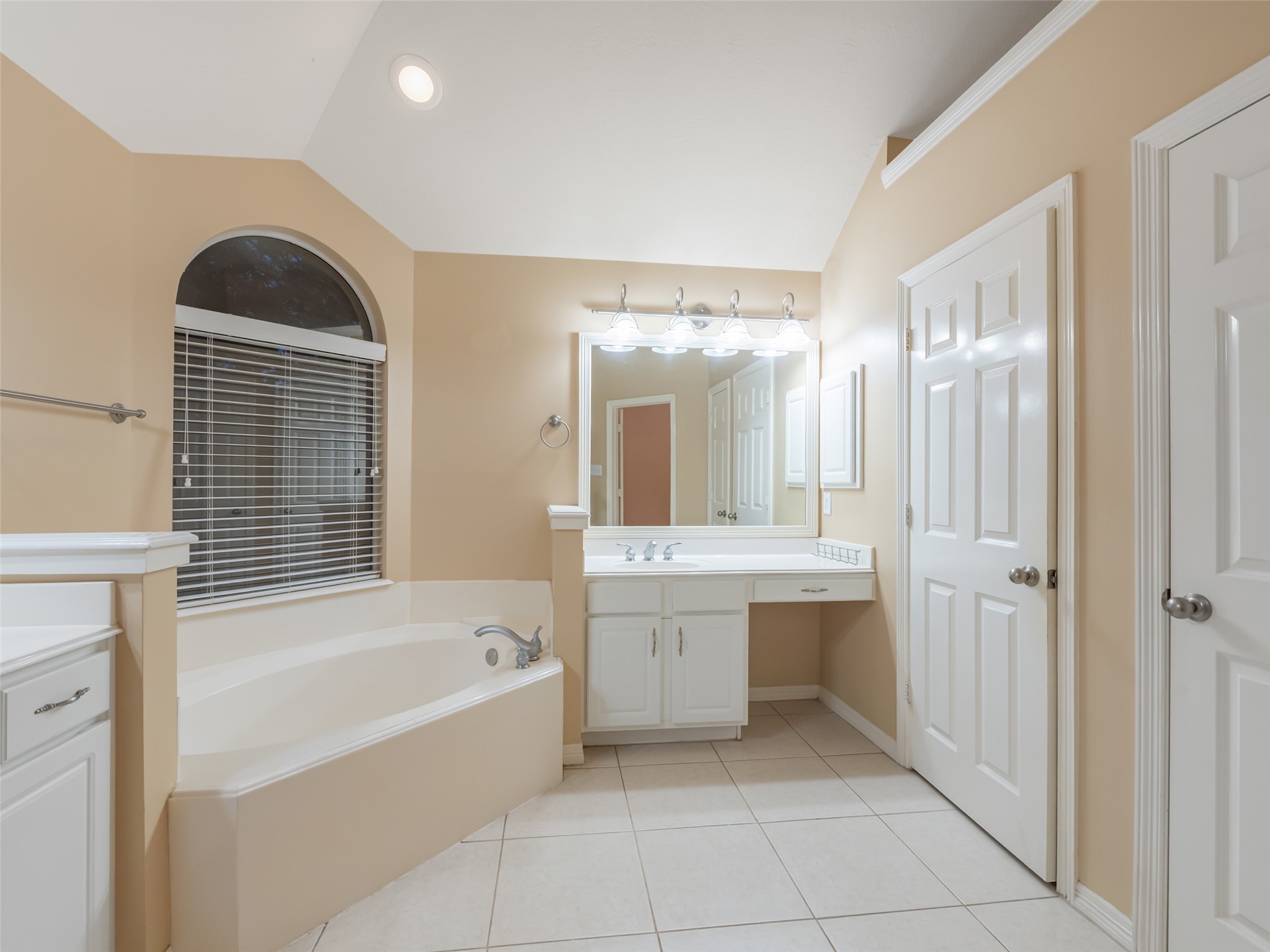 1511 Baldridge Lane Katy, TX 77494 - Photo 30 of 50 a bathroom with a bathtub sink and mirror
