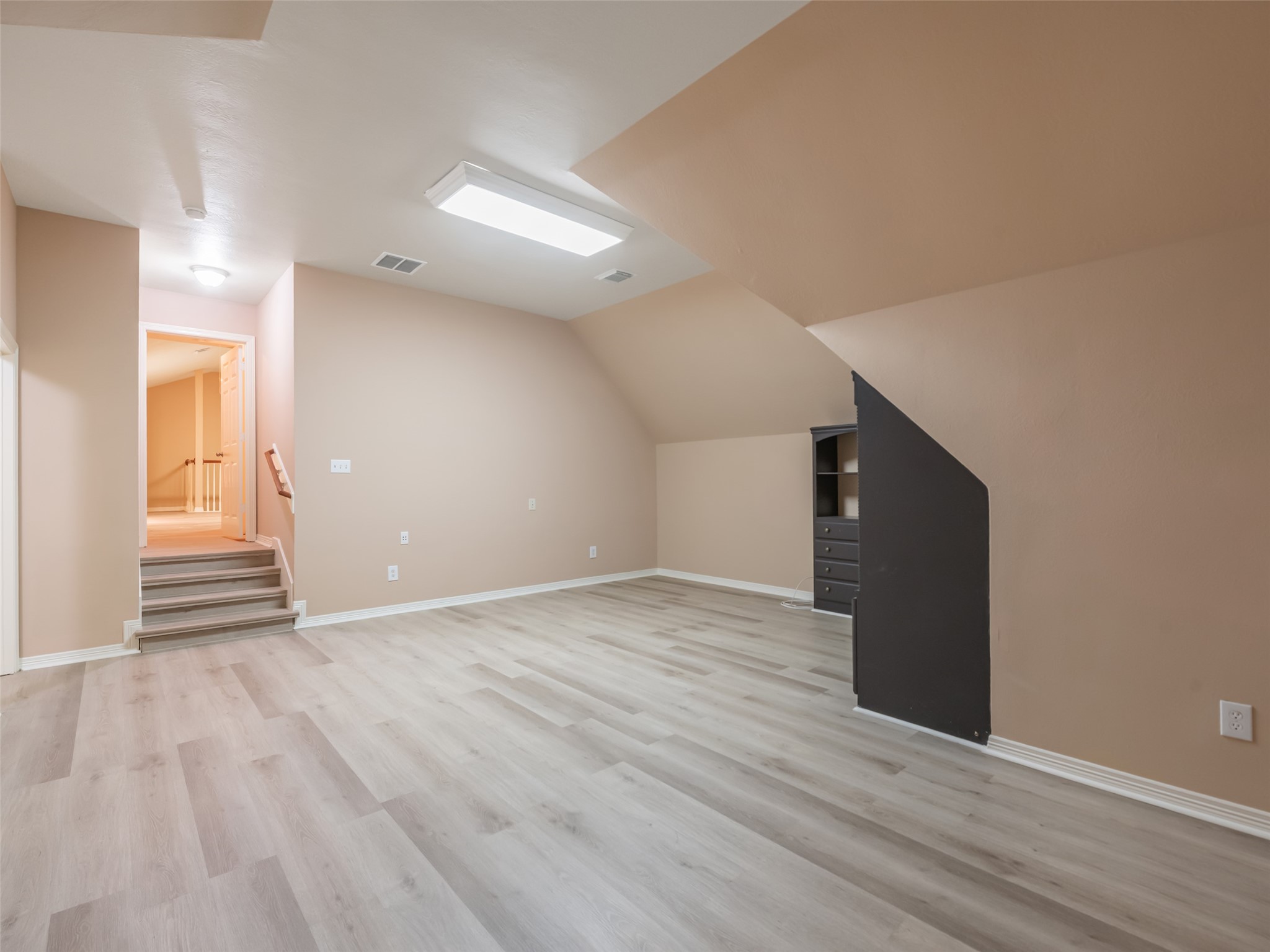 1511 Baldridge Lane Katy, TX 77494 - Photo 41 of 50 a view of an empty room with wooden floor