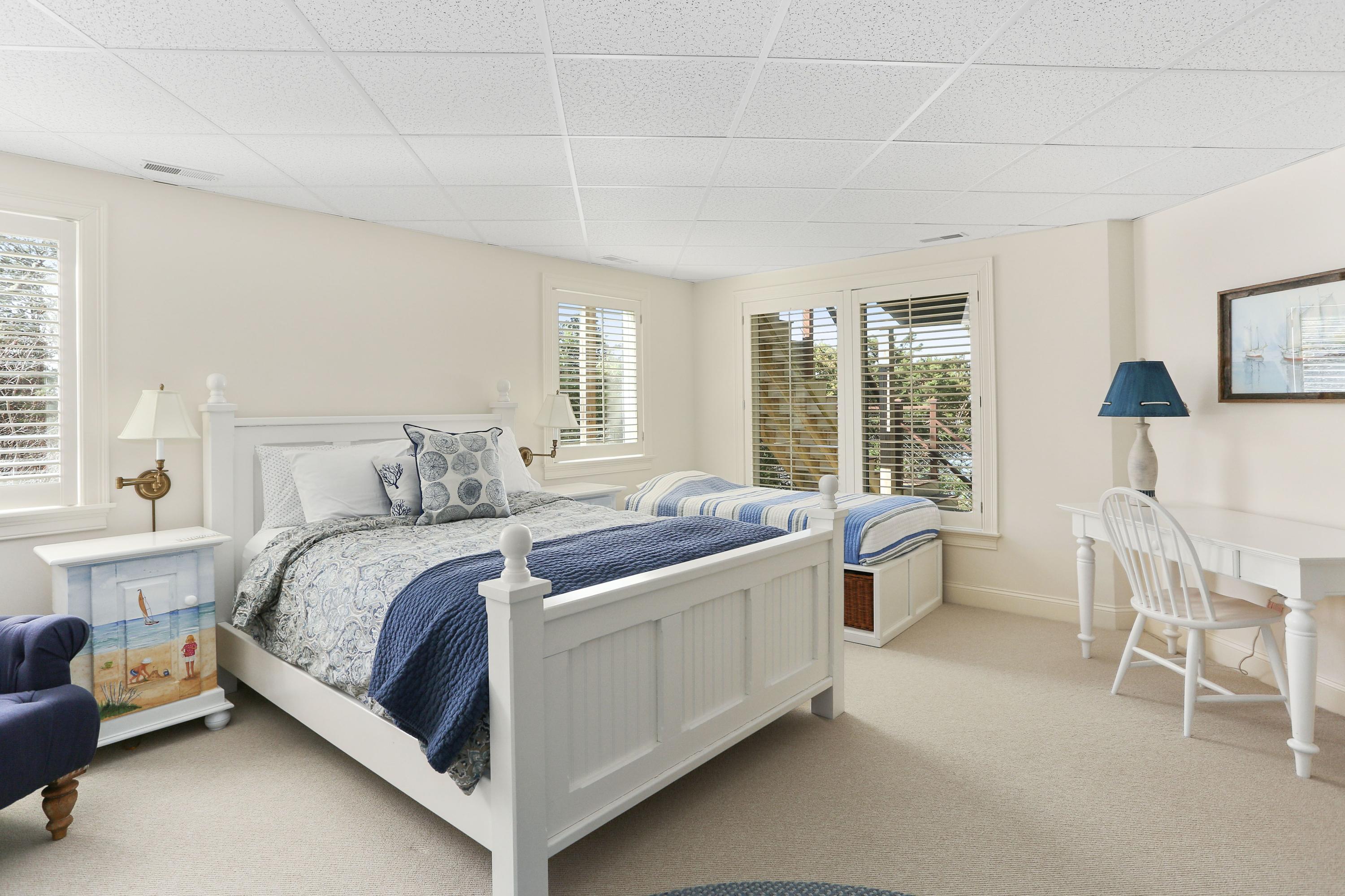 31 Ruggles Road Orleans, MA 02653 - Photo 44 of 61 a bed room with a bed and a table chair
