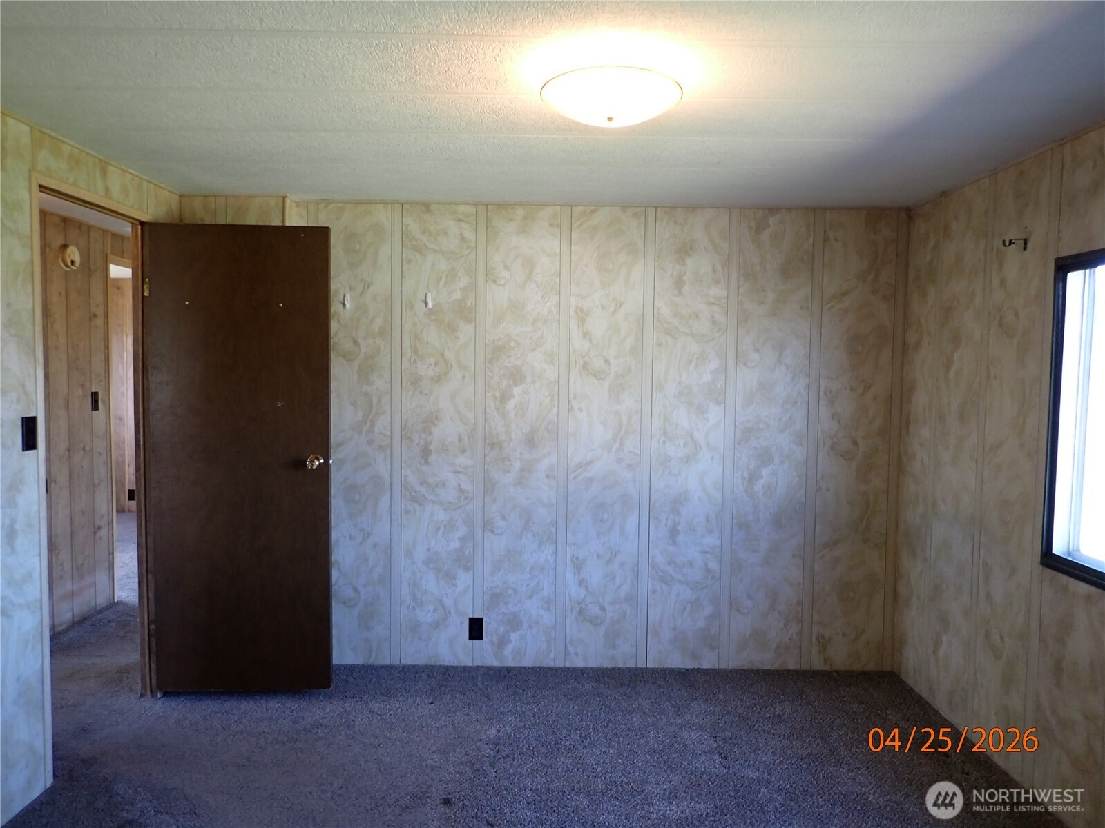 9217 183rd Avenue Southwest Rochester, WA 98579 - Photo 19 of 26 an empty room with a door