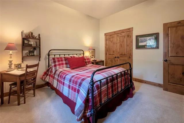 a bedroom with a bed and a table in it