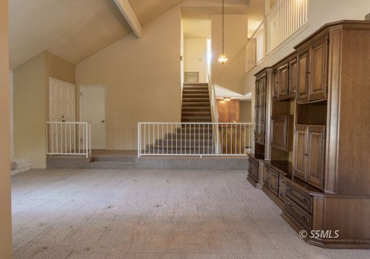 924 Scott Street Ridgecrest, CA 93555 - Photo 4 of 26 a view of a porch with wooden floor and stairs