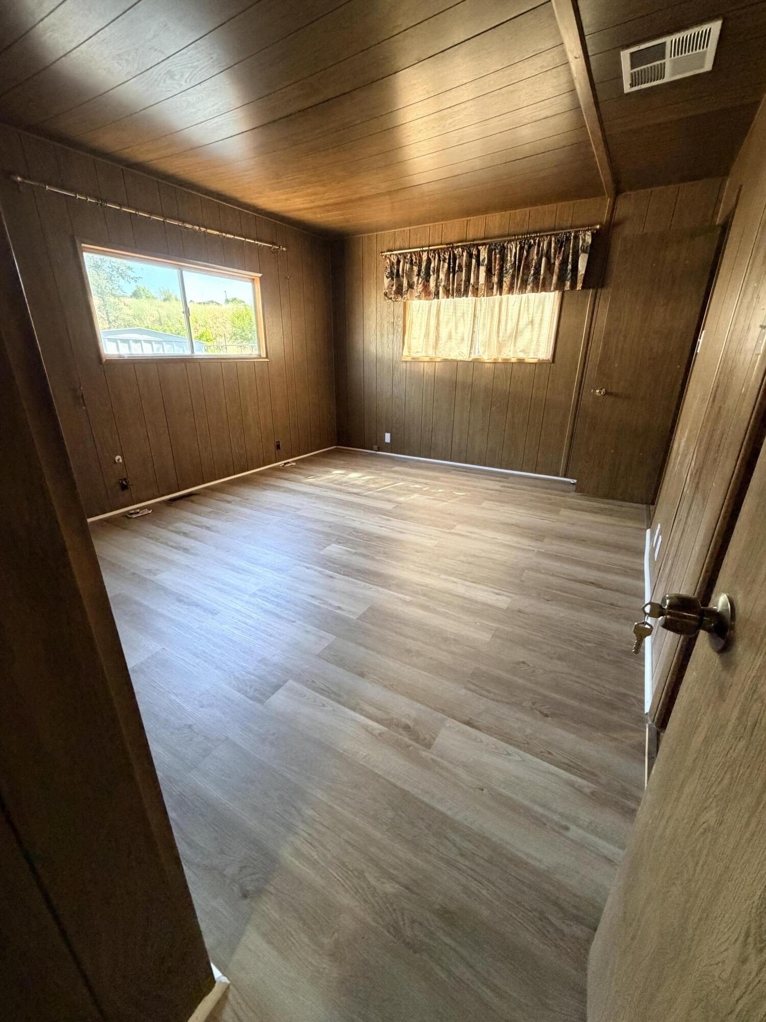 1449 Menomenee Lane, Unit 252 Redding, CA 96003 - Photo 13 of 18 an empty room with windows