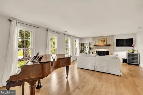 a living room with furniture fireplace and flat screen tv