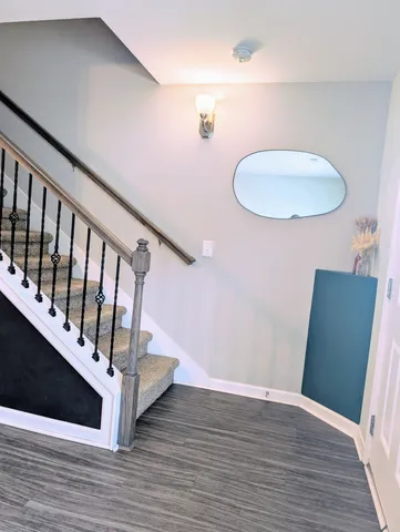 a view of entryway with wooden floor