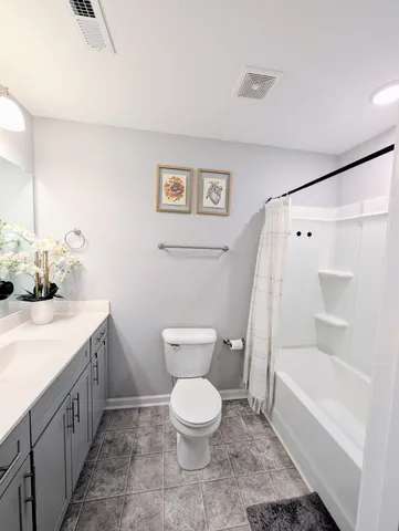 a bathroom with a toilet sink and a bathtub