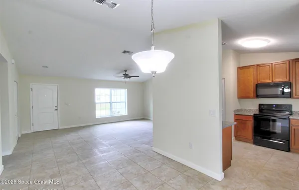 a view of a kitchen with a stove cabinets and a kitchen