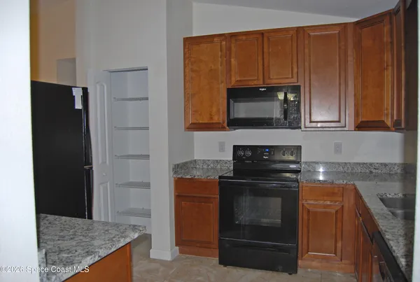 a kitchen with a stove and a microwave