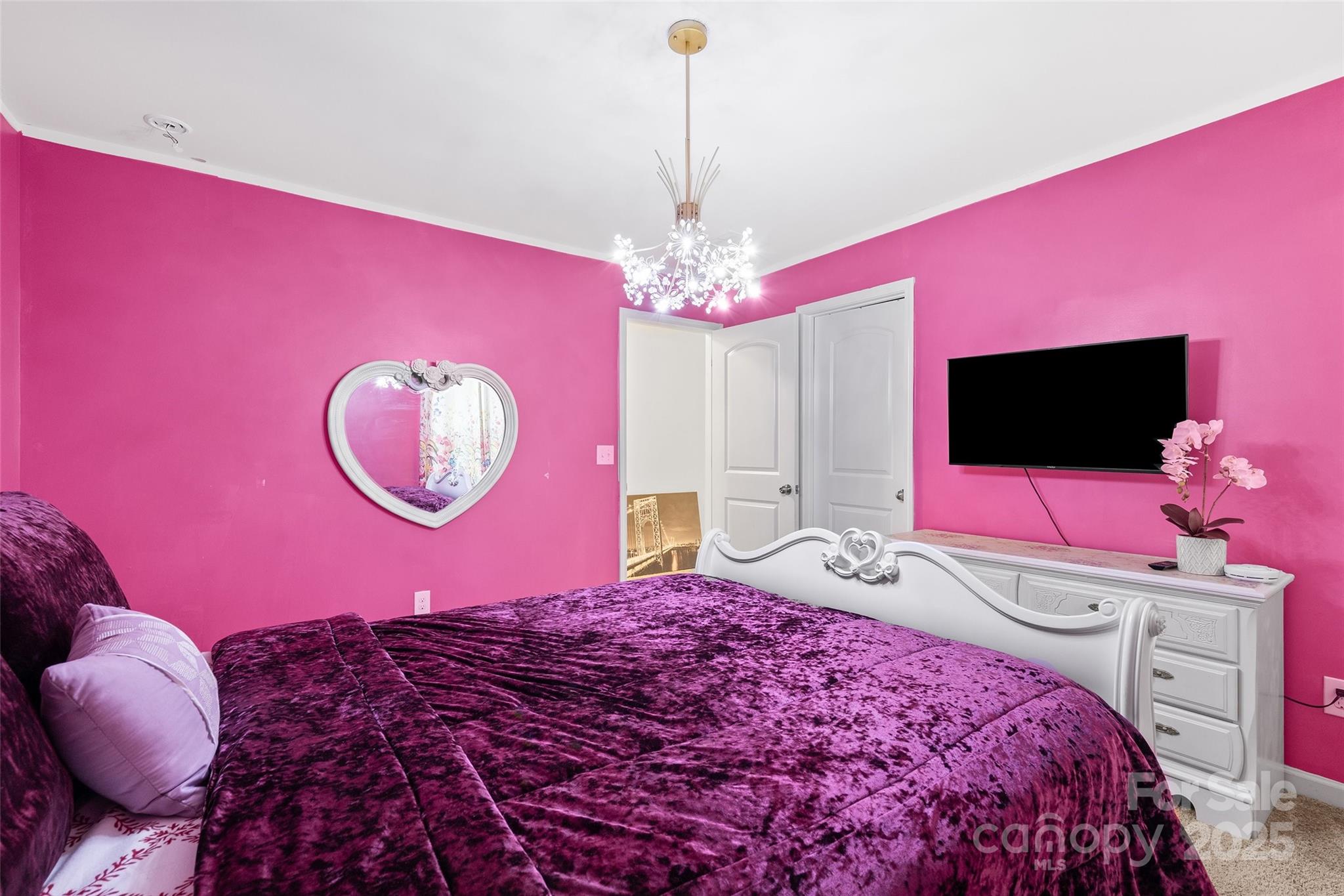 14027 Ridgewater Way Charlotte, NC 28278 - Photo 15 of 48 a bedroom with a bed and a flat screen tv