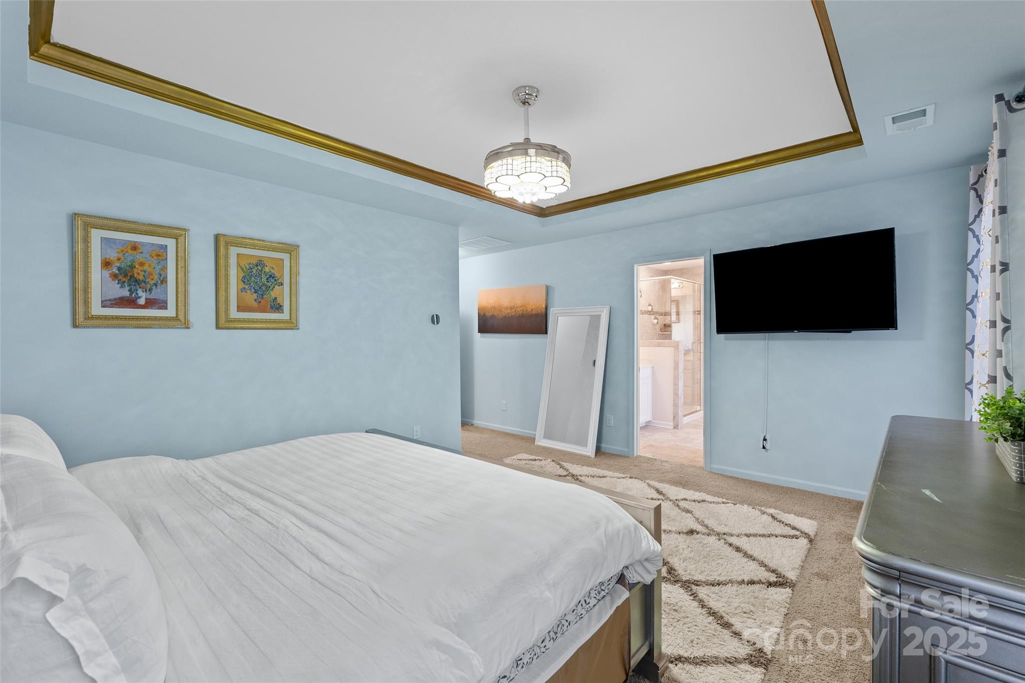 14027 Ridgewater Way Charlotte, NC 28278 - Photo 18 of 48 a bedroom with a bed and a flat screen tv