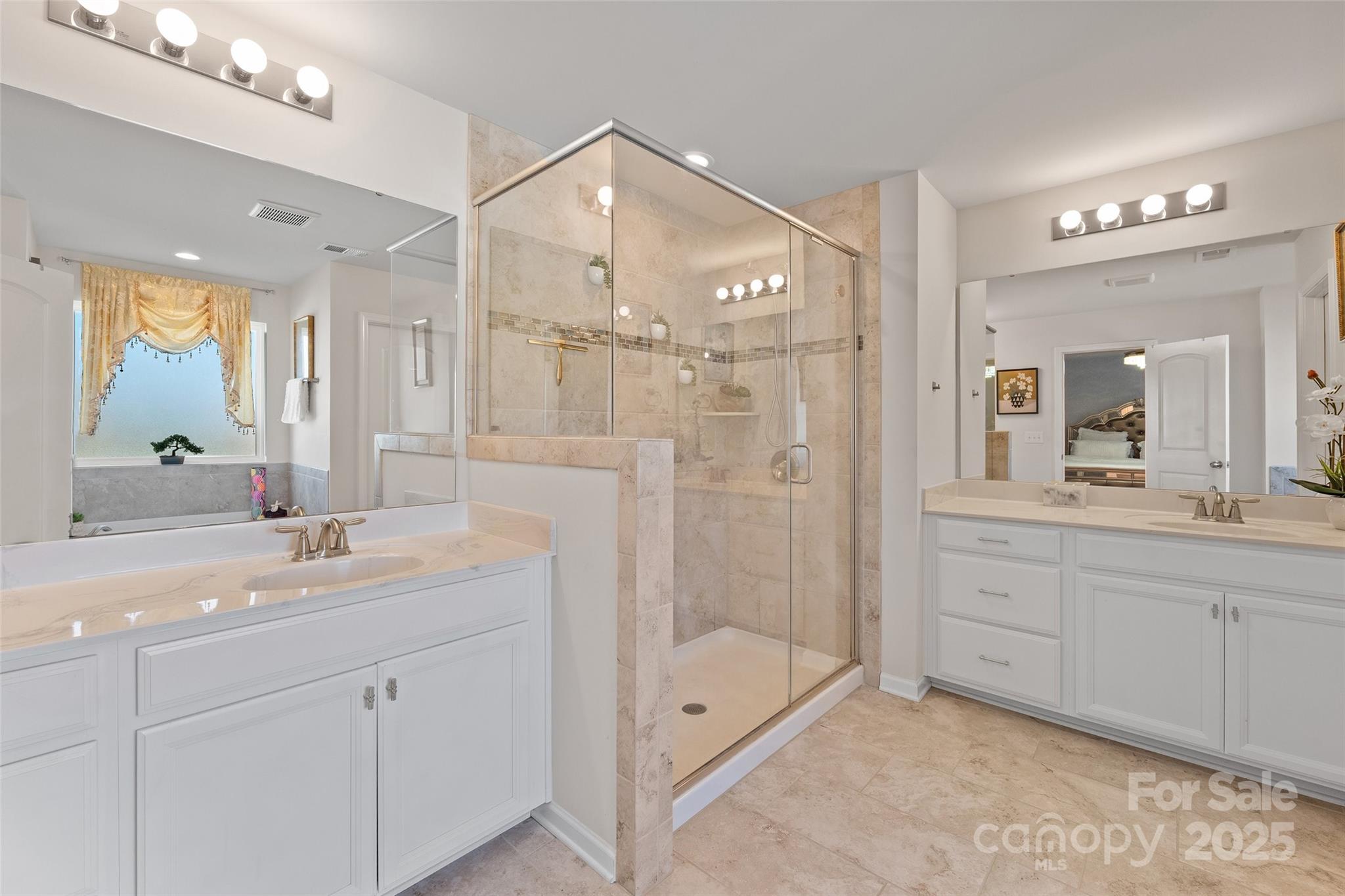 14027 Ridgewater Way Charlotte, NC 28278 - Photo 20 of 48 a spacious bathroom with a shower sink vanity granite and mirror