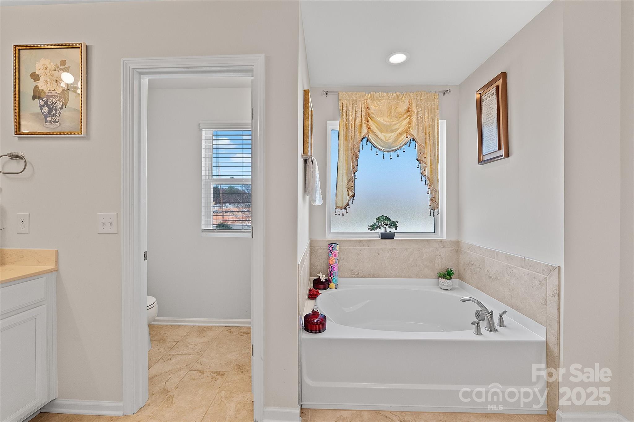 14027 Ridgewater Way Charlotte, NC 28278 - Photo 21 of 48 a bathroom with a tub and a shower