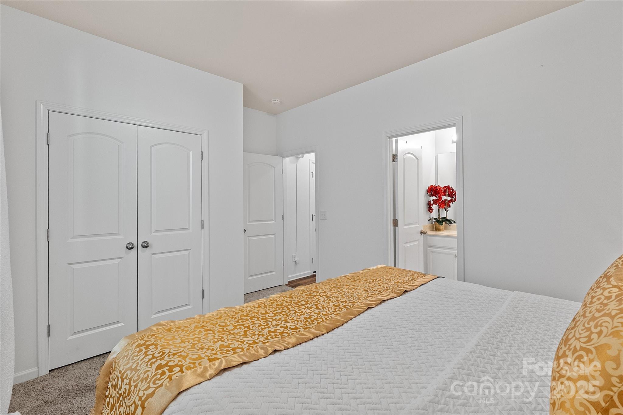 14027 Ridgewater Way Charlotte, NC 28278 - Photo 26 of 48 a bedroom with a bed and cabinets