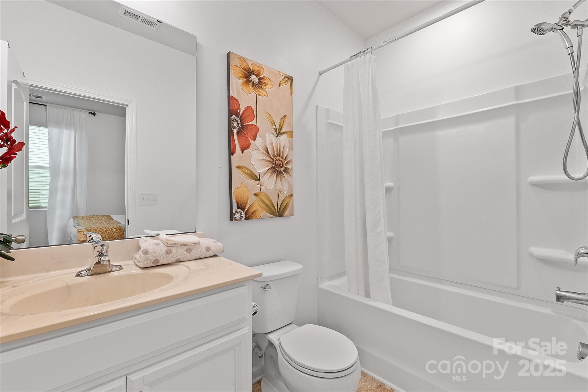 14027 Ridgewater Way Charlotte, NC 28278 - Photo 27 of 48 a bathroom with a sink a toilet and shower