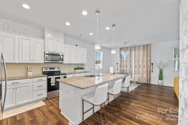 a living room with furniture fireplace and a flat screen tv