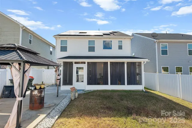 a very nice looking house with a fountain in front of it