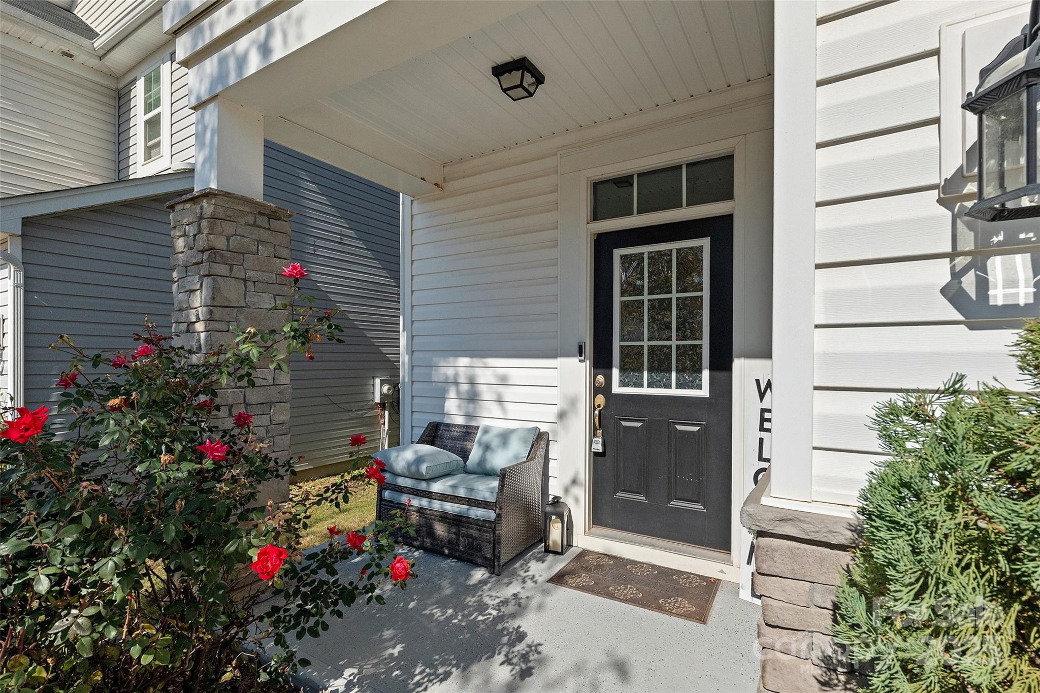 14027 Ridgewater Way Charlotte, NC 28278 - Photo 6 of 48 a front view of a house with a porch