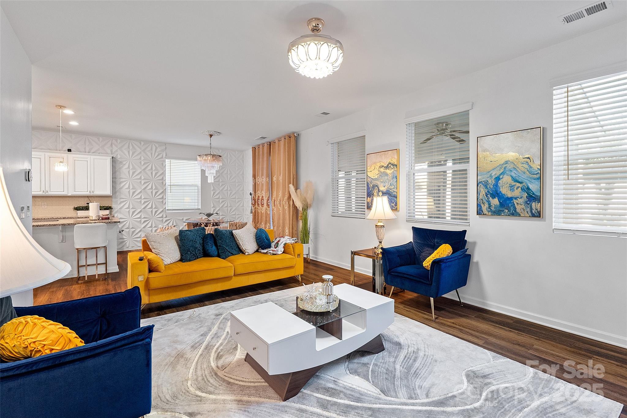 14027 Ridgewater Way Charlotte, NC 28278 - Photo 7 of 48 a living room with furniture and a wooden floor