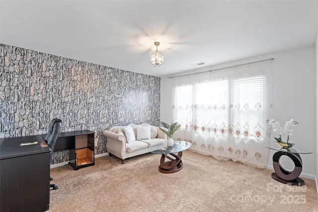 a workspace with furniture and a potted plant