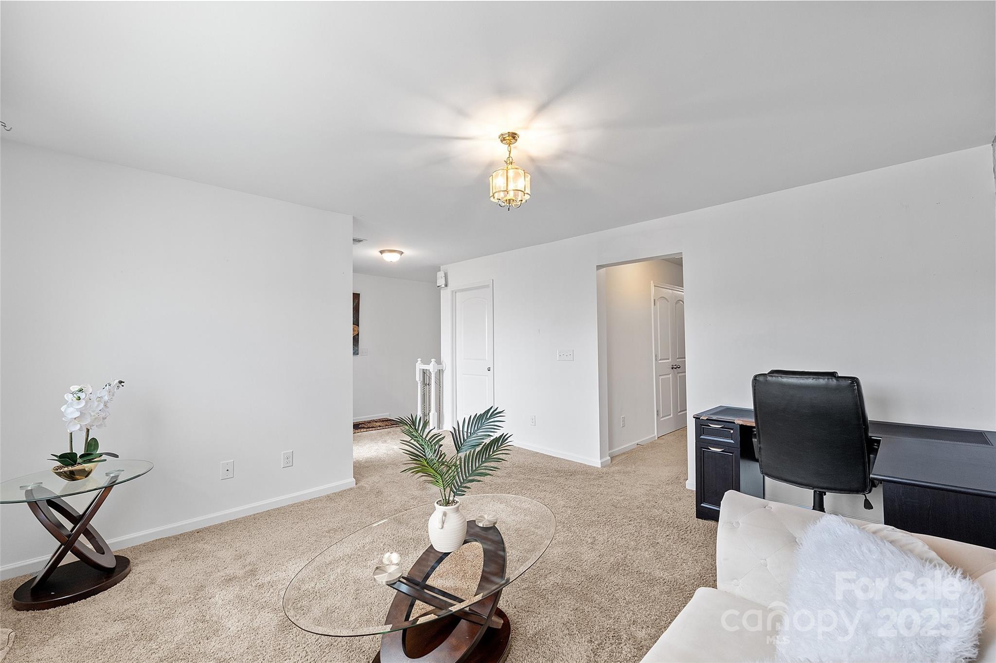 14027 Ridgewater Way Charlotte, NC 28278 - Photo 9 of 48 a workspace with furniture and a potted plant