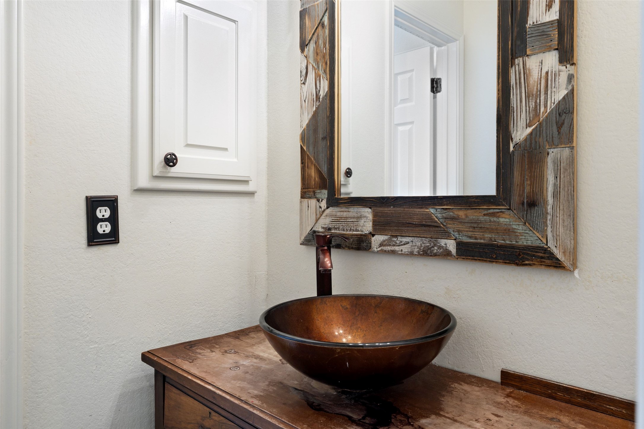 815 Elliott Ranch Road Buda, TX 78610 - Photo 15 of 40 Bathroom with a textured wall and vanity