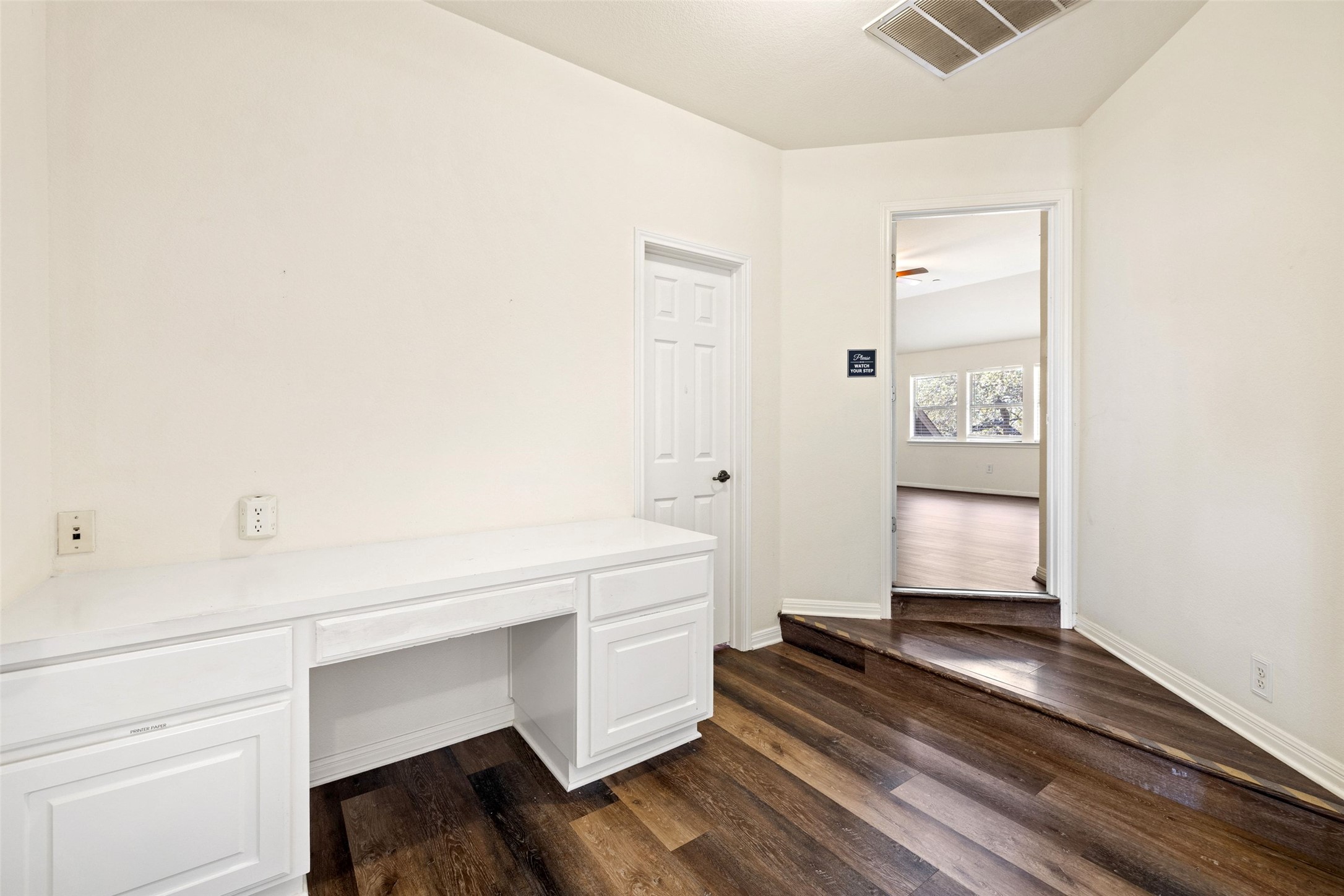 815 Elliott Ranch Road Buda, TX 78610 - Photo 22 of 40 Unfurnished office space with dark wood-style flooring and baseboards